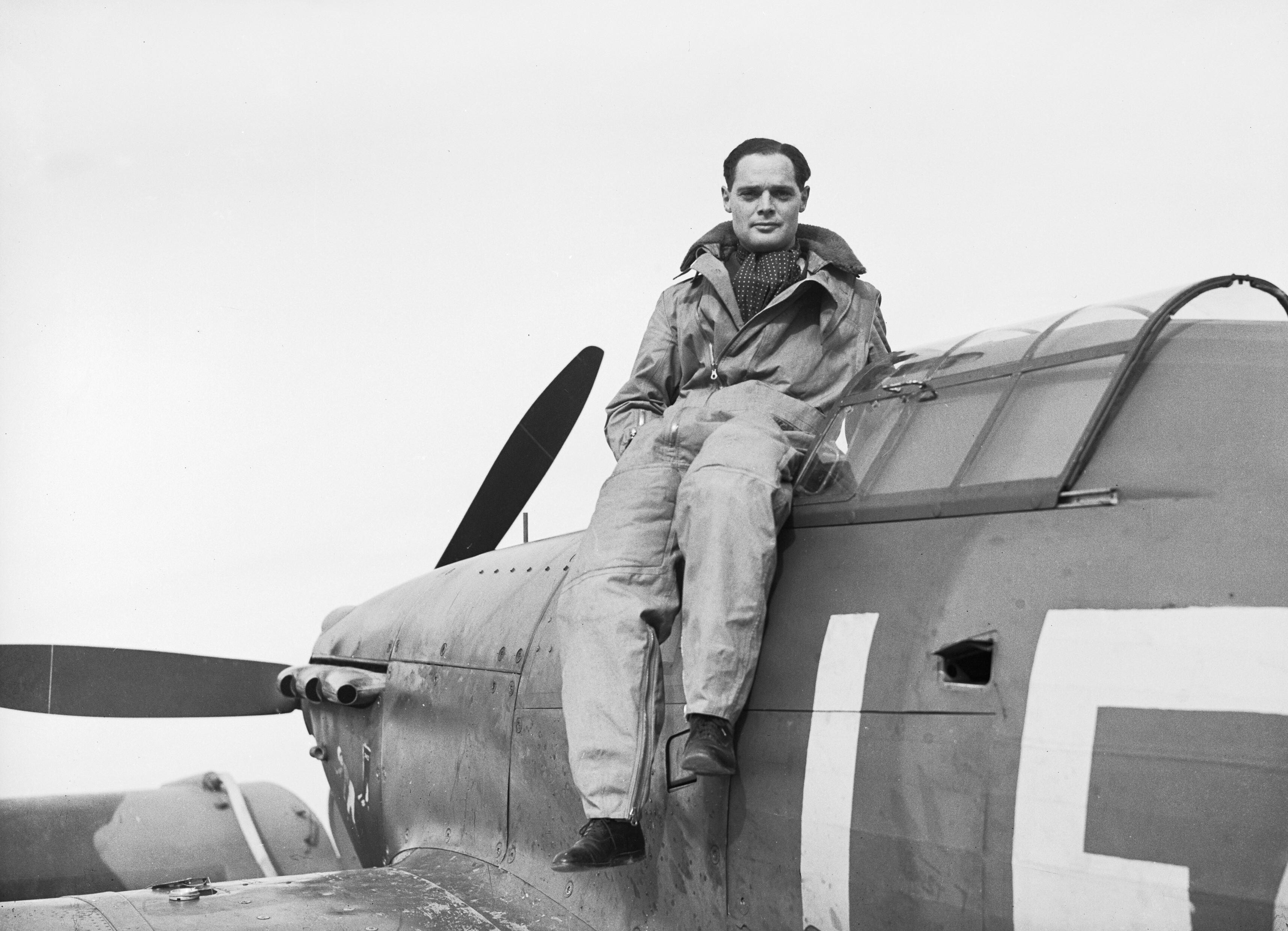 The photograph shows a pilot seated in his Hawker Hurricane at Duxford in September 1940. Who is he, an ace known for fighting despite having lost both legs?